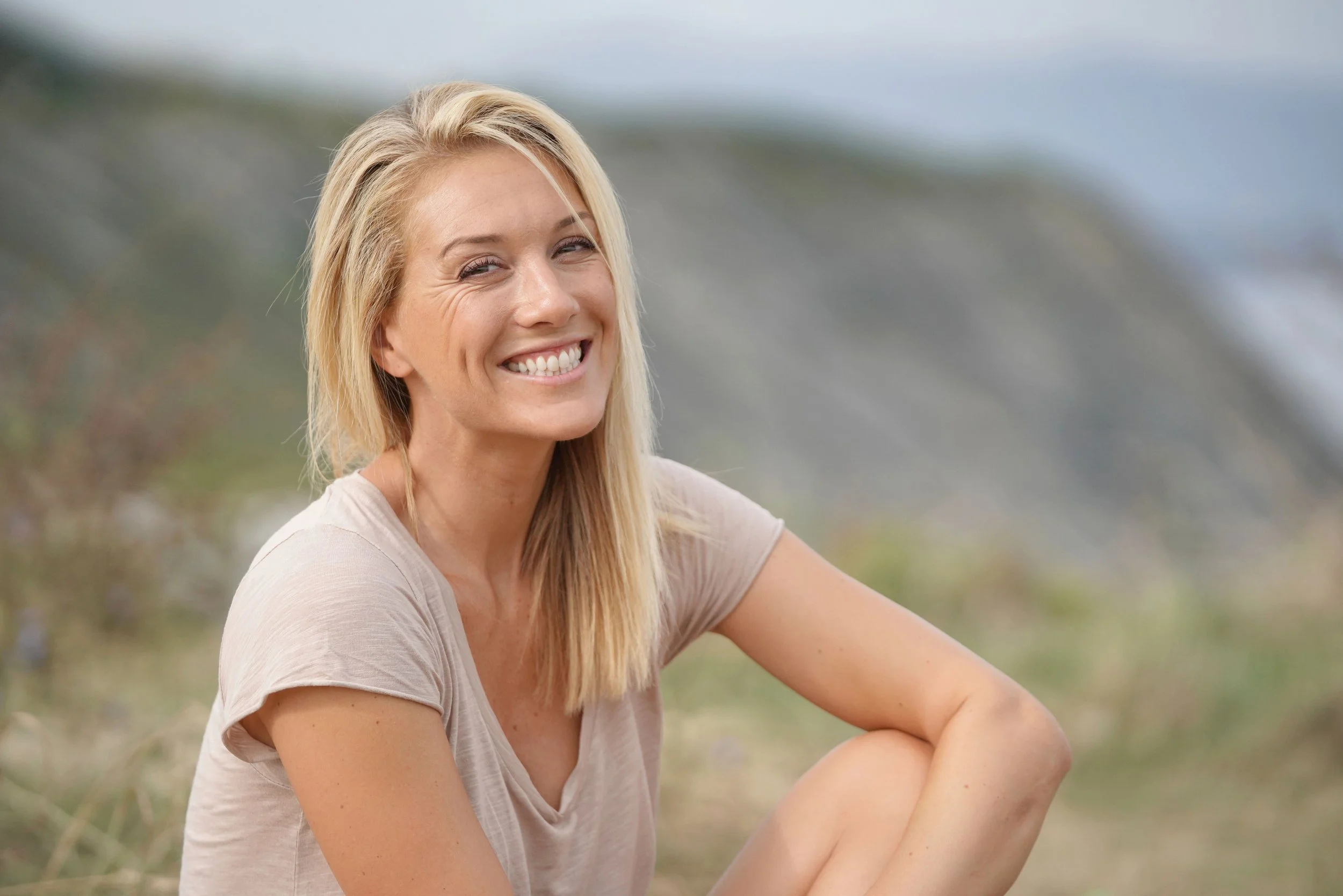 smiling woman after upper blepharoplasty