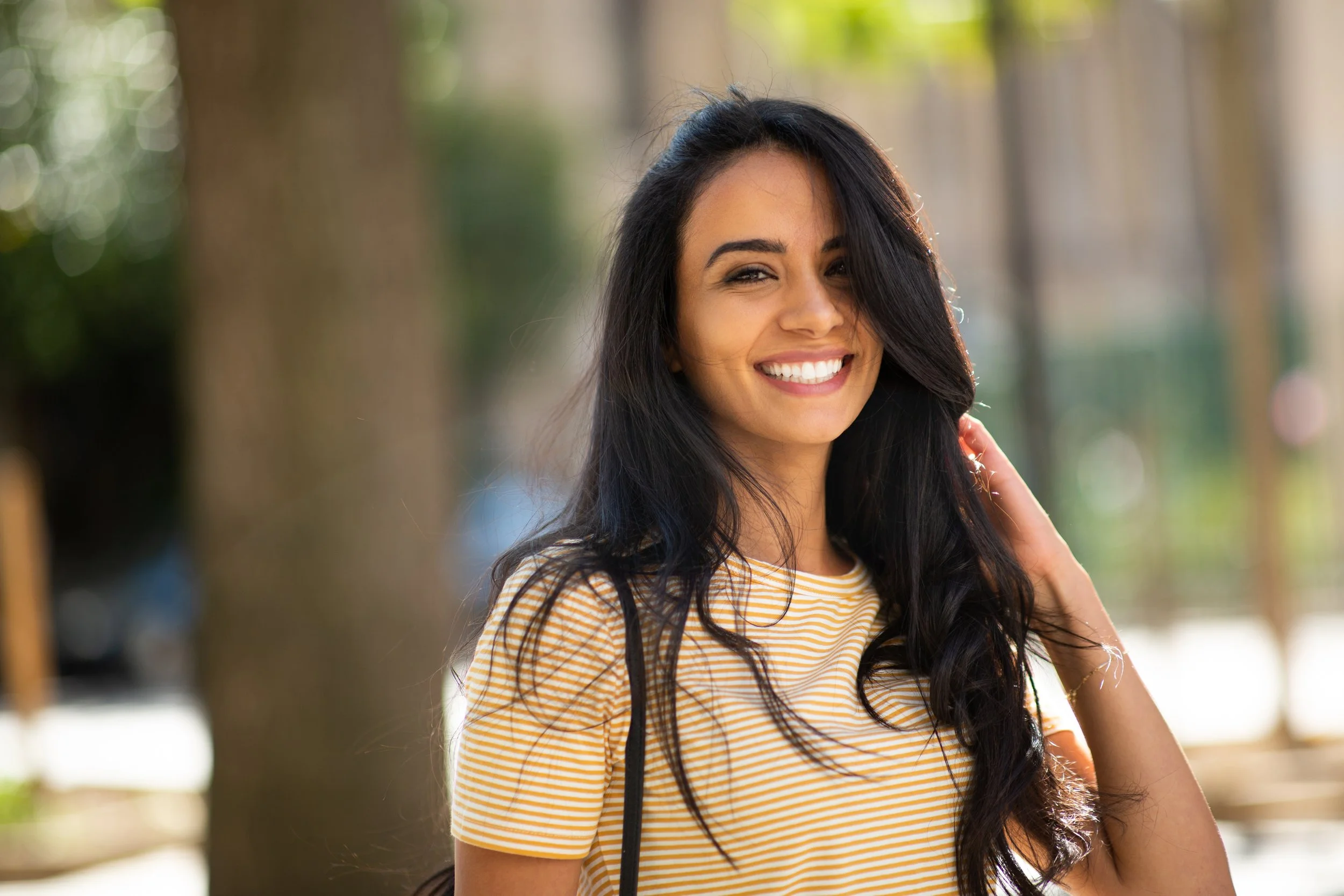 smiling woman after forehead reduction
