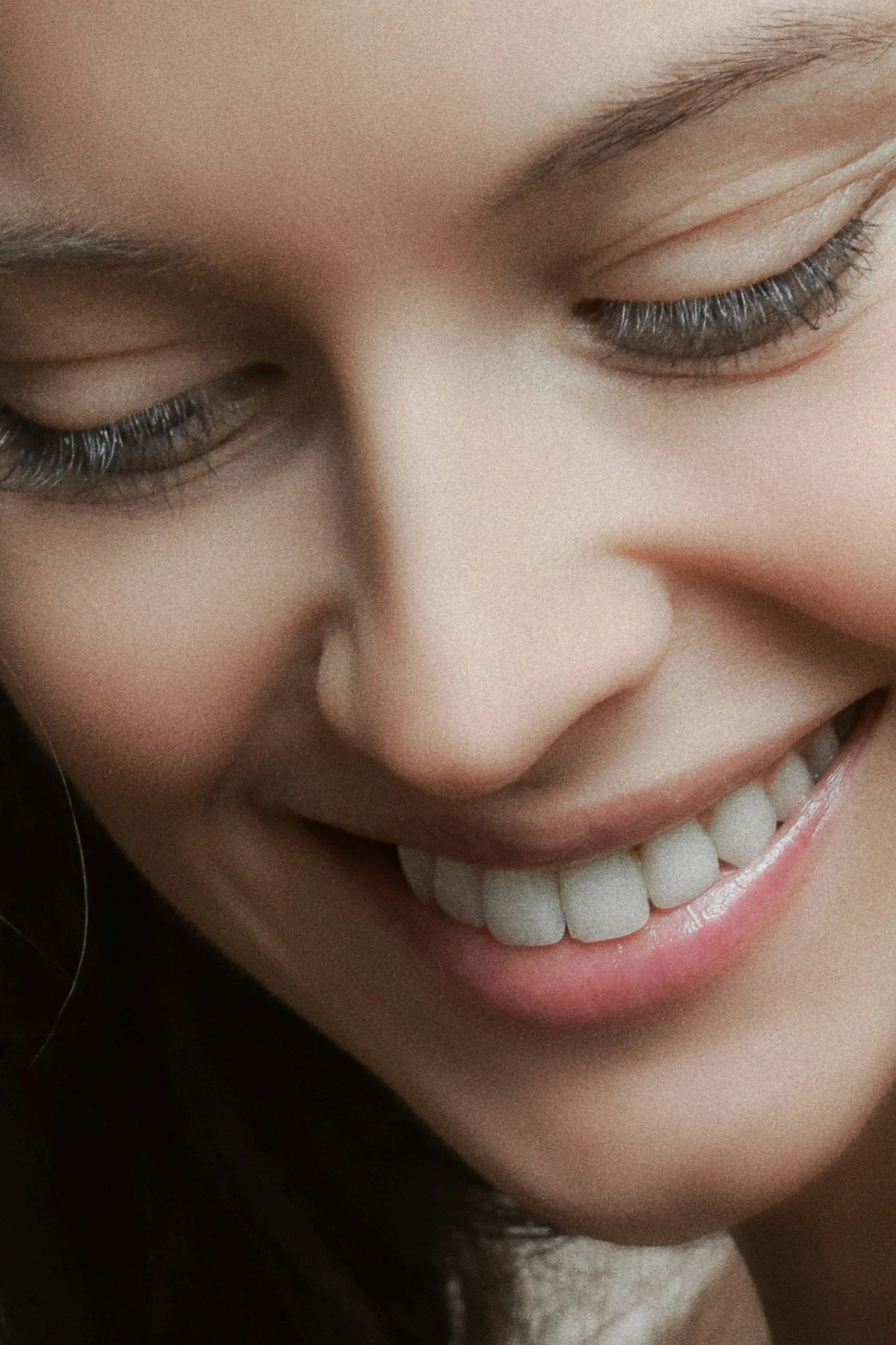 Woman smiling after rhinoplasty – Misch Facial Plastics