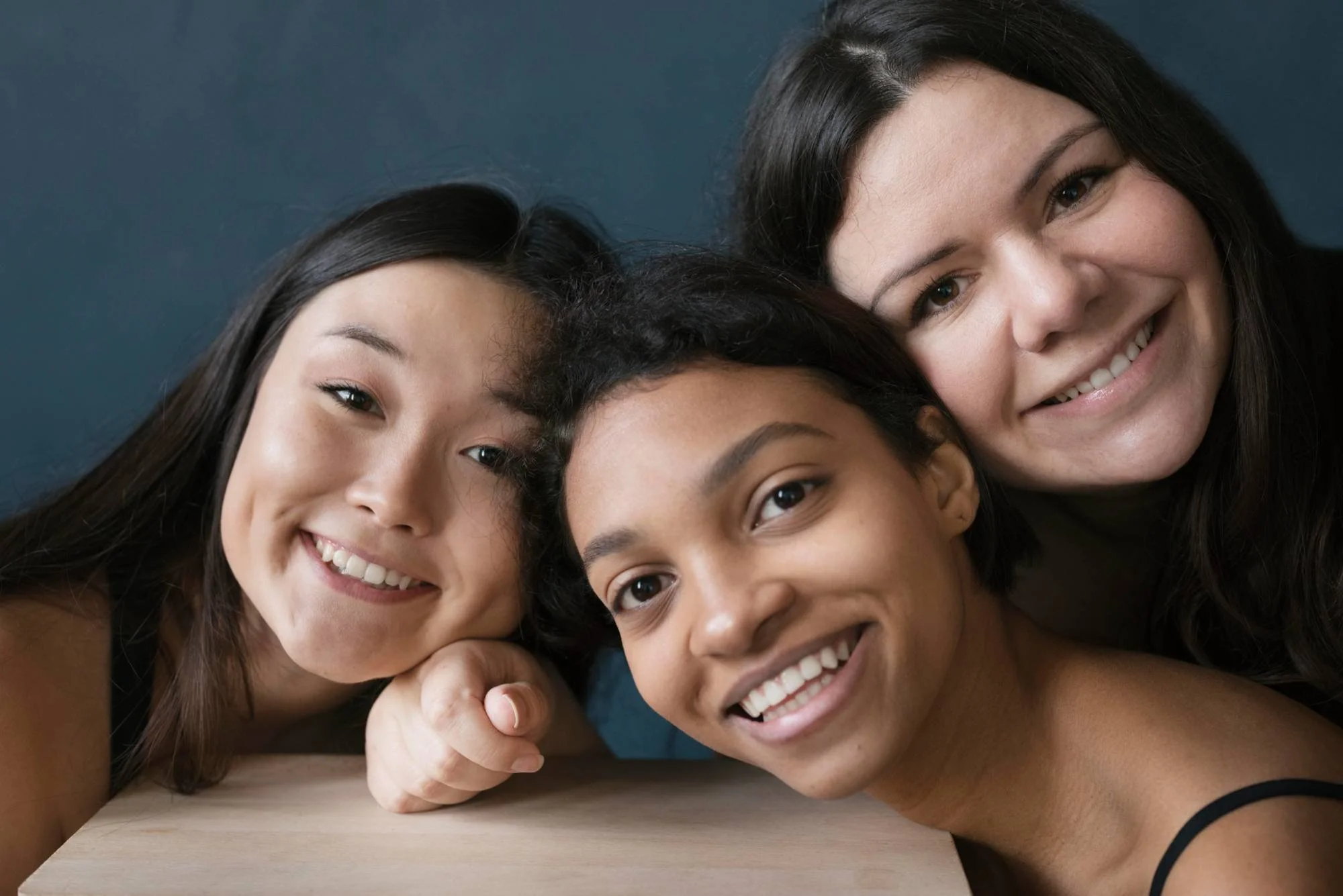 Group of women smiling at Misch Facial Plastics